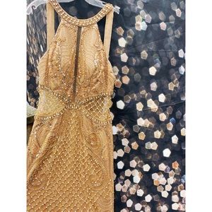 Jovani Color:gold ,tan, with rose gold. Size :10 fits like a 8